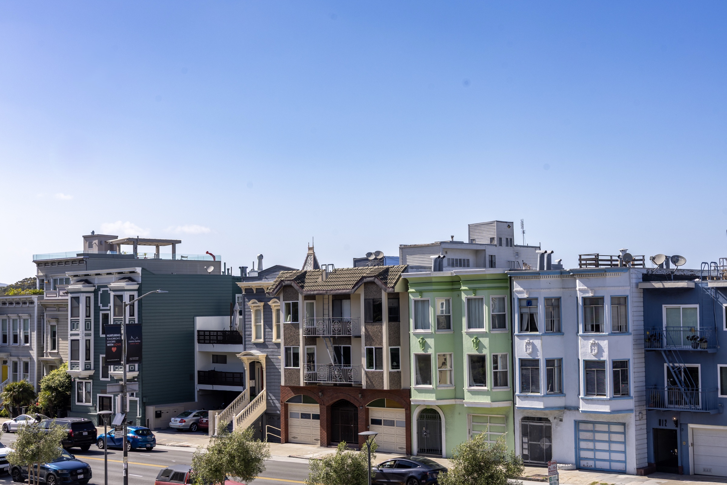 A row of San Francisco houses under a clear sky